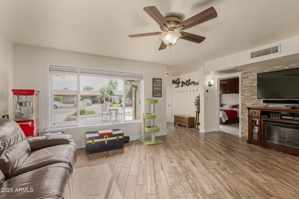 a living room with furniture and a flat screen tv
