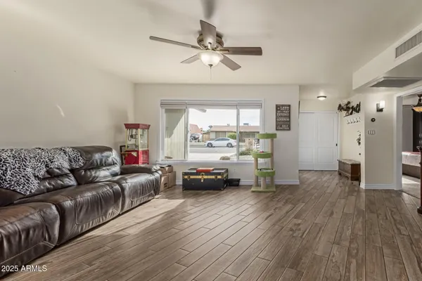 a living room with furniture and a large window