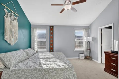 a bedroom with a bed and a tv