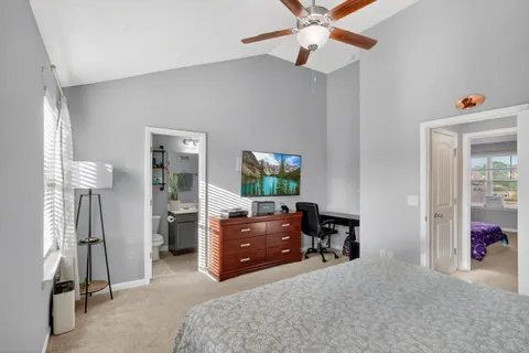a bedroom with furniture and a window