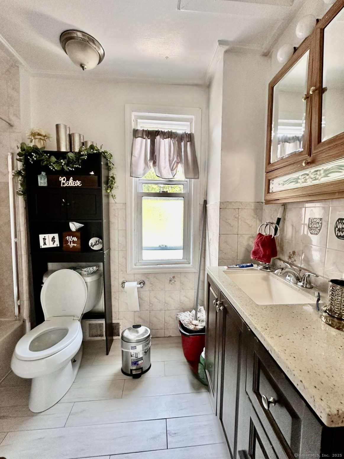 444 Poplar Street New Haven, CT 06513 - Photo 13 of 17 a bathroom with a toilet a sink and a window