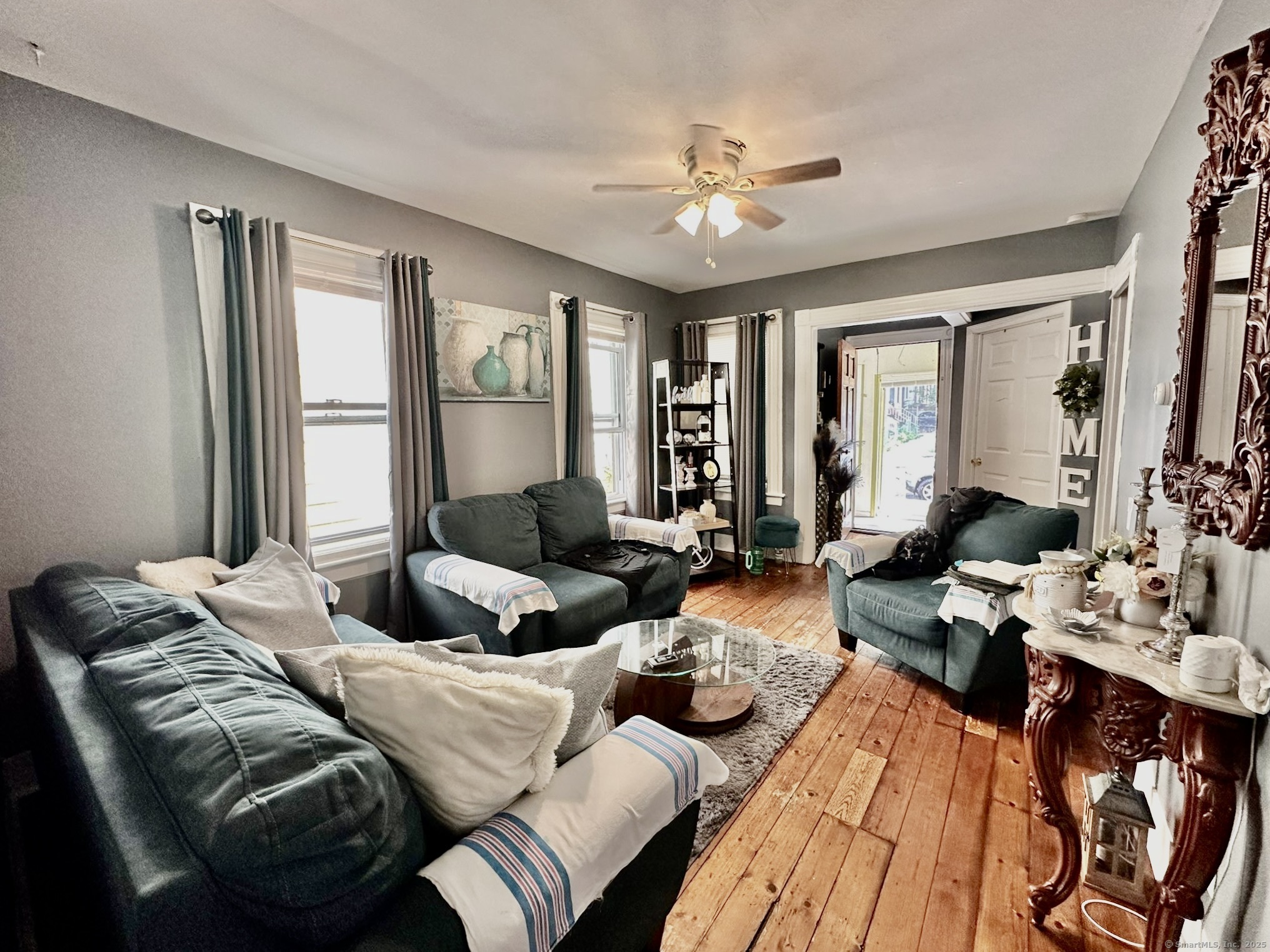 444 Poplar Street New Haven, CT 06513 - Photo 2 of 17 a living room with furniture and large windows