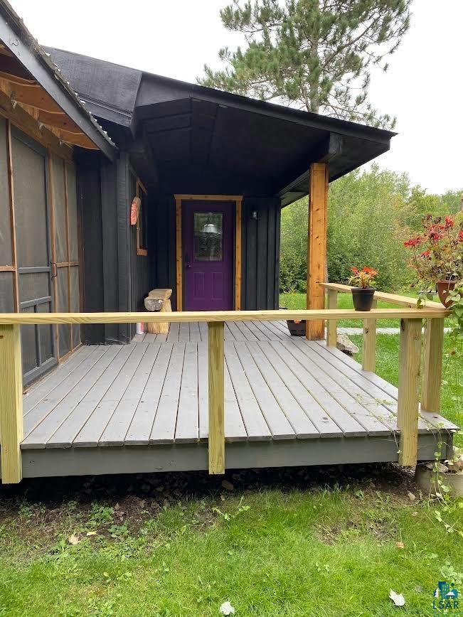 1896 Echo Trail Ely, MN 55731 - Photo 16 of 20 Entrance to property featuring a wooden deck and a metal roof