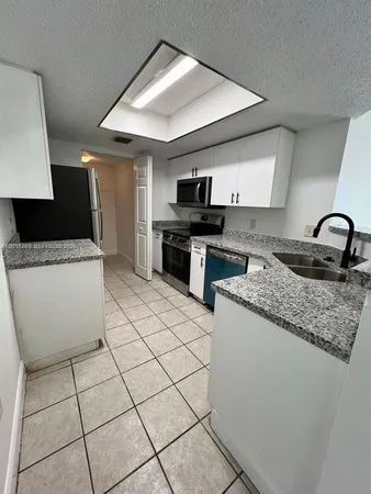 $287,500 | 5065 Wiles Road, Unit 103, Coconut Creek, FL 33073