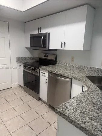 $287,500 | 5065 Wiles Road, Unit 103, Coconut Creek, FL 33073
