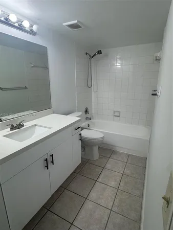 $287,500 | 5065 Wiles Road, Unit 103, Coconut Creek, FL 33073