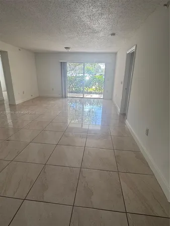$287,500 | 5065 Wiles Road, Unit 103, Coconut Creek, FL 33073