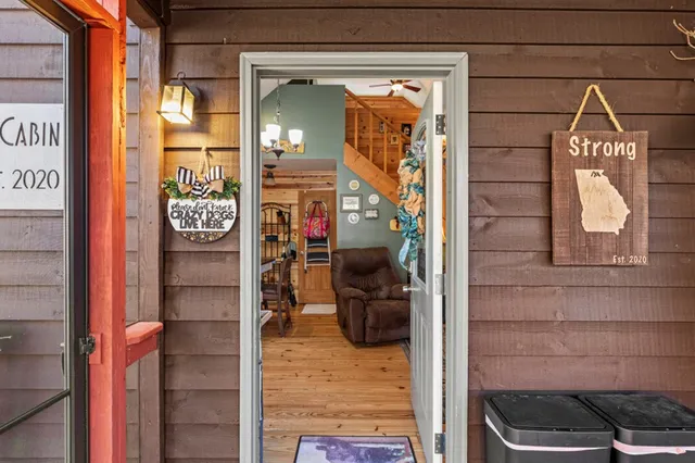 a kitchen with stainless steel appliances granite countertop a stove a sink dishwasher and cabinets with wooden floor