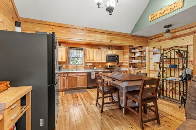 a bedroom with a bed and wooden balcony