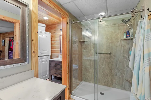 a bathroom with a sink a toilet and a window