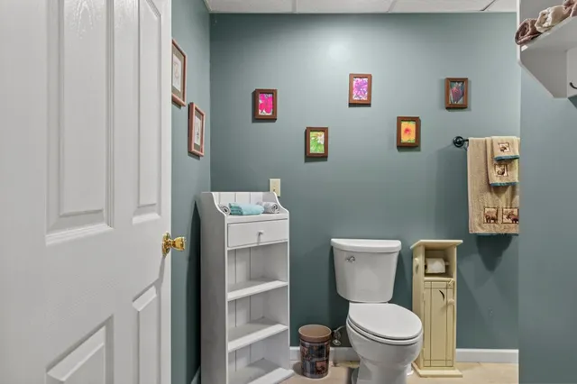 an aerial view of a house with a yard and trees