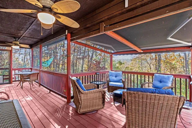 a living room with furniture ceiling fan and a rug