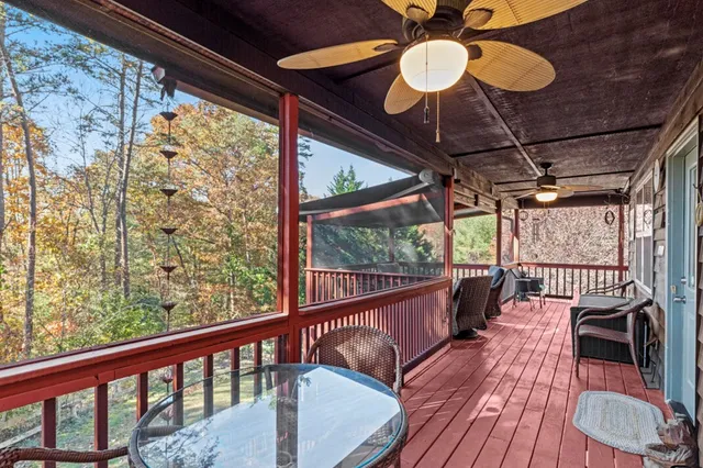 a living room with furniture a fireplace and a table