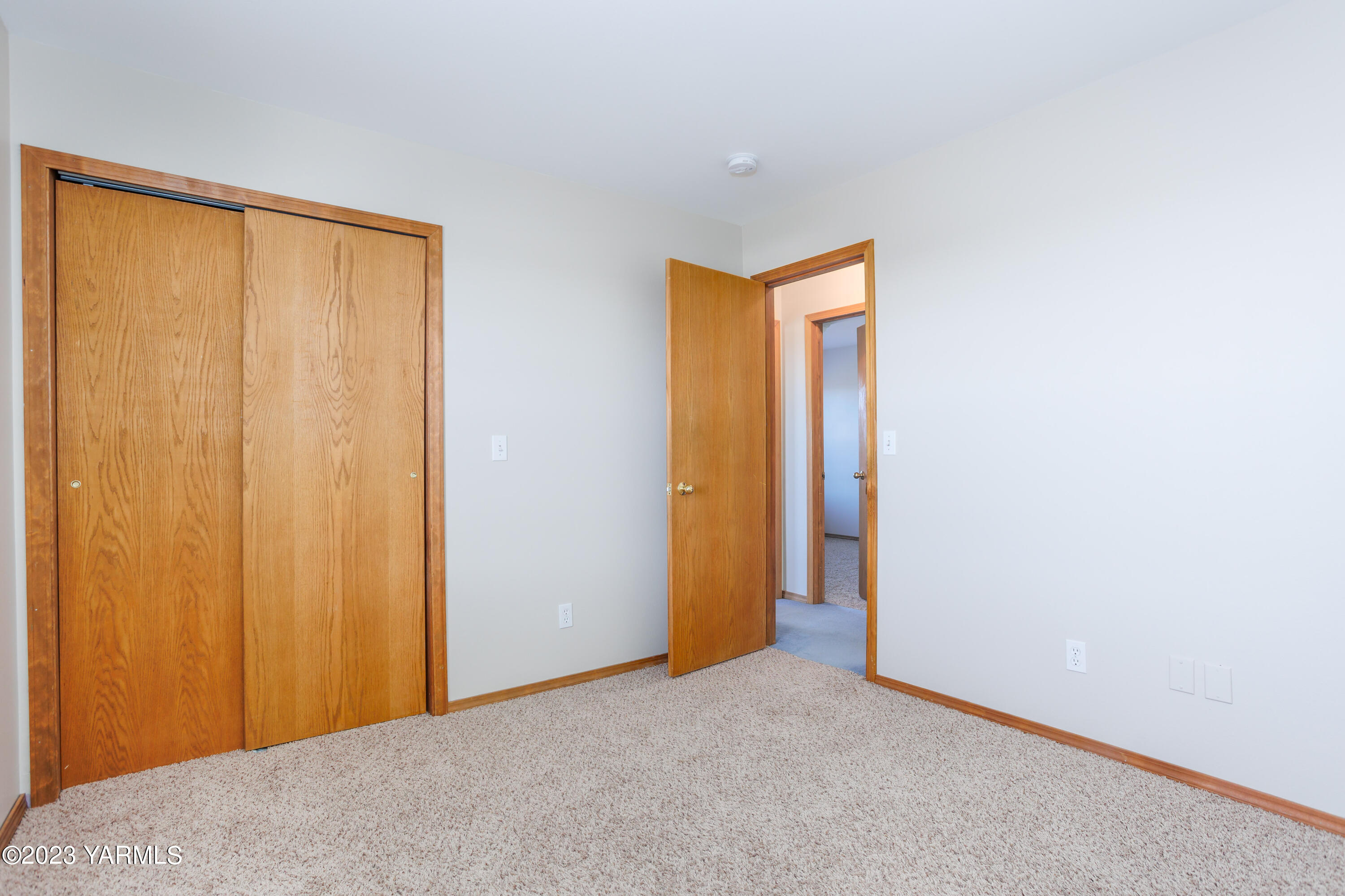 2231 Arrowsmith Road Sunnyside, WA 98944 - Photo 26 of 49 a view of an empty room with closet and wooden door