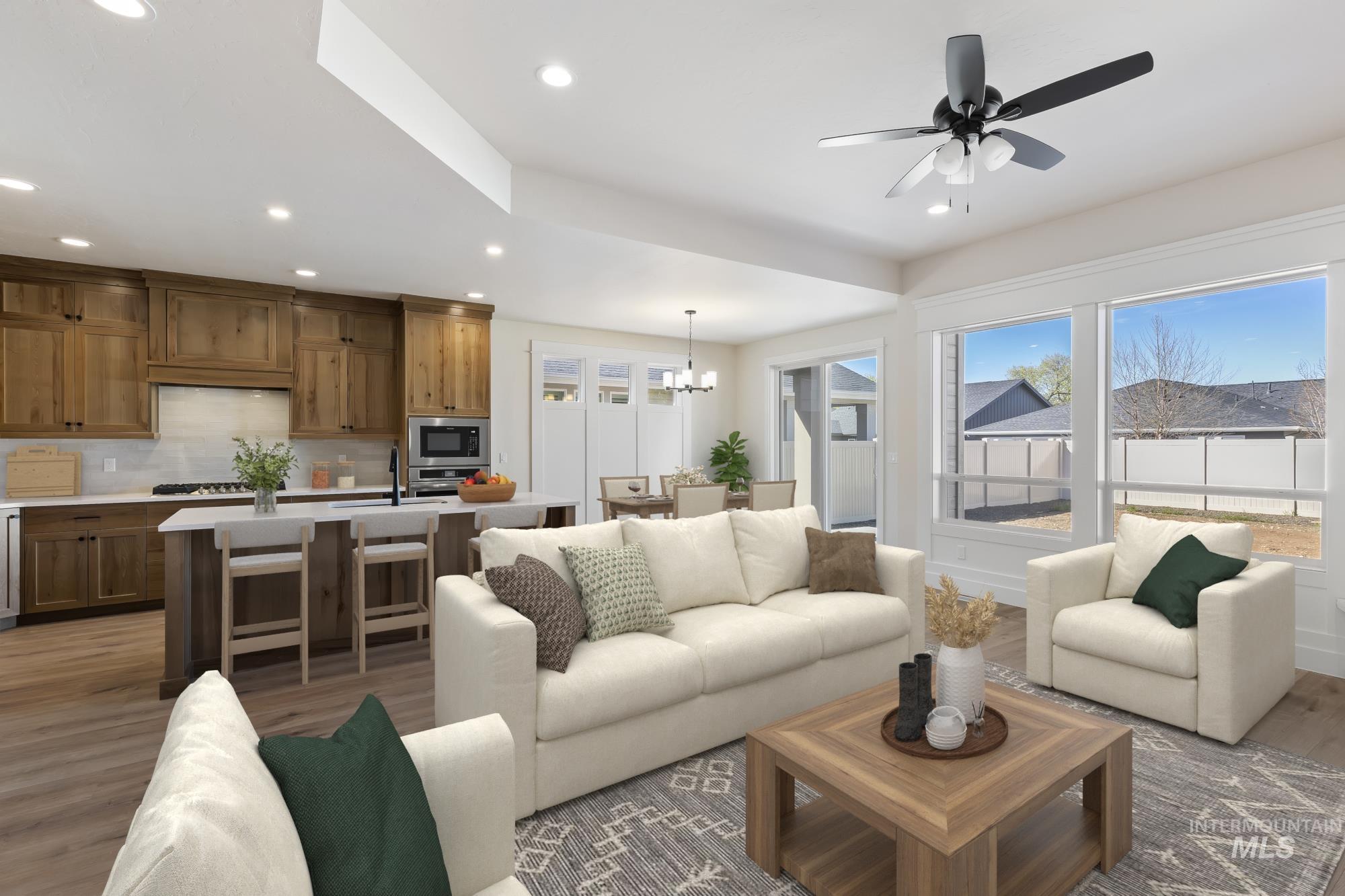 3501 South El Rio Avenue Boise, ID 83709 - Photo 12 of 31 Living room featuring light wood-style flooring, a ceiling fan, and suspended lighting