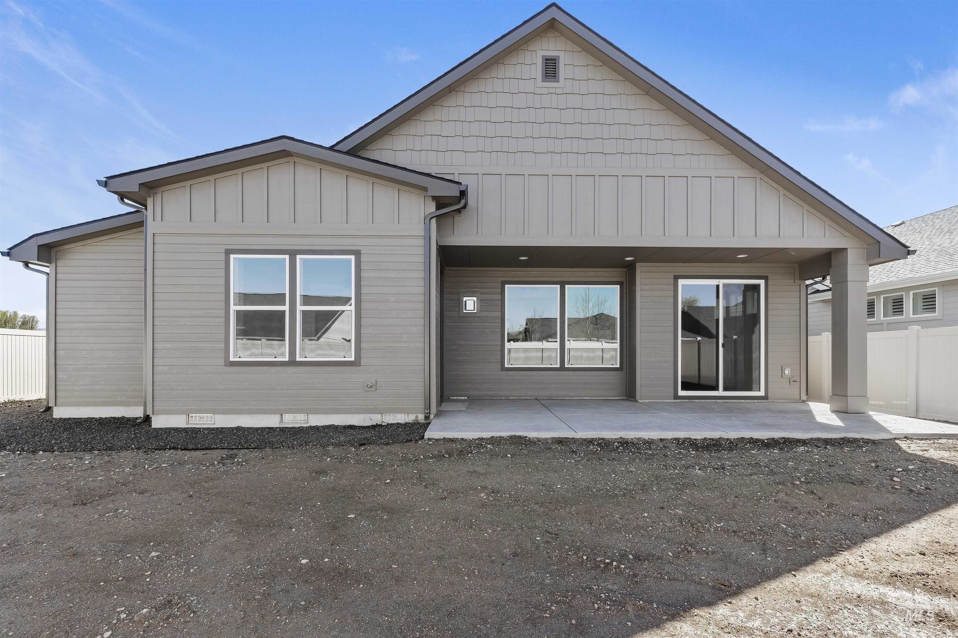 3501 South El Rio Avenue Boise, ID 83709 - Photo 31 of 31 Rear view of property featuring board and batten siding, crawl space, and a patio area
