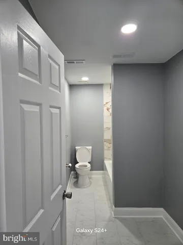 a bathroom with a toilet