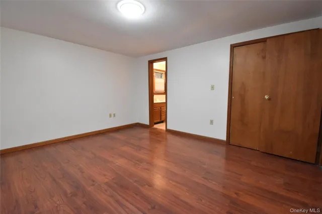 wooden floor and window in an empty room