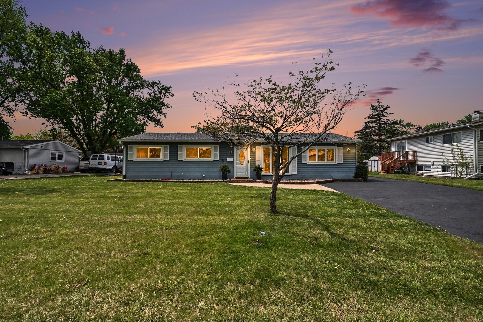 48 Pueblo Road Montgomery, IL 60538 - Photo 2 of 33 a front view of a house with garden