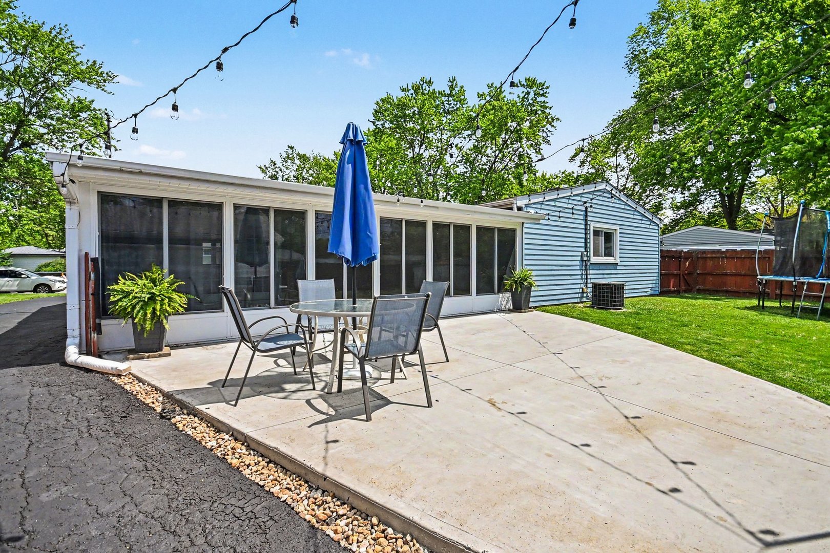 48 Pueblo Road Montgomery, IL 60538 - Photo 22 of 33 a view of a patio with table and chairs and potted plants