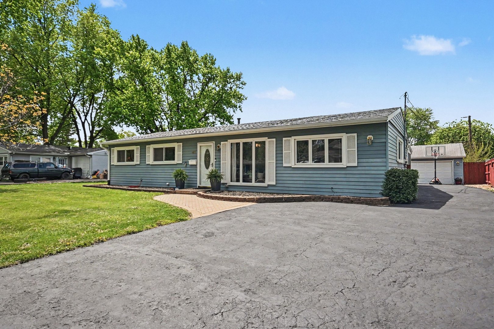 48 Pueblo Road Montgomery, IL 60538 - Photo 3 of 33 a house view with a backyard space