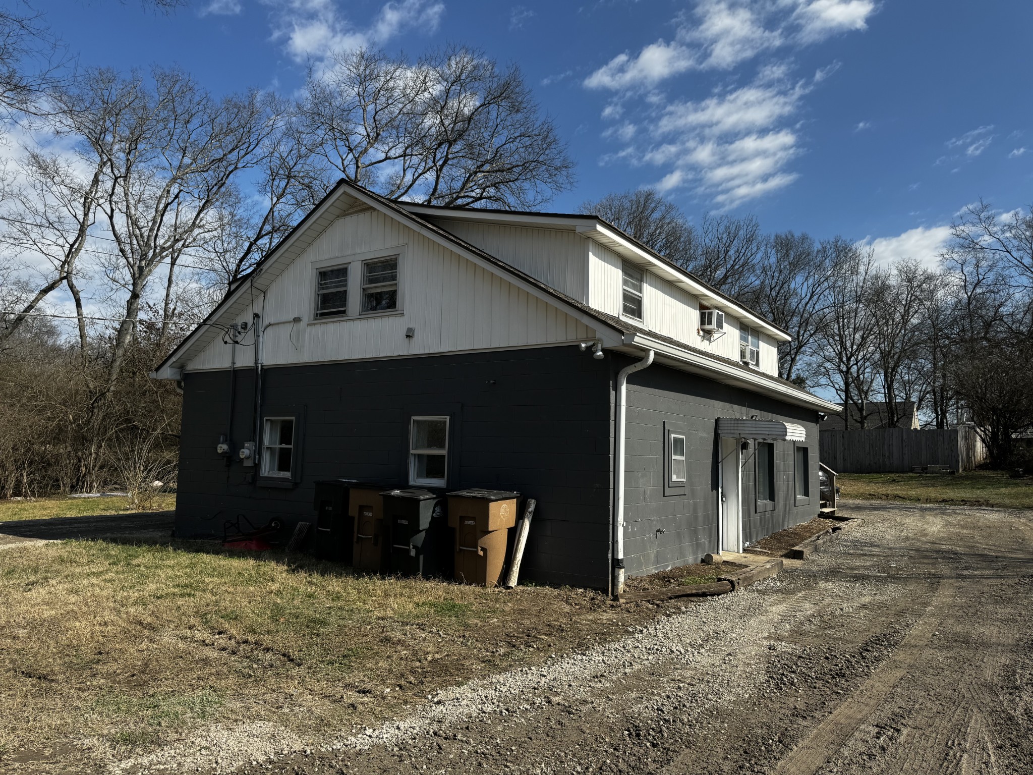 a house with trees in the background