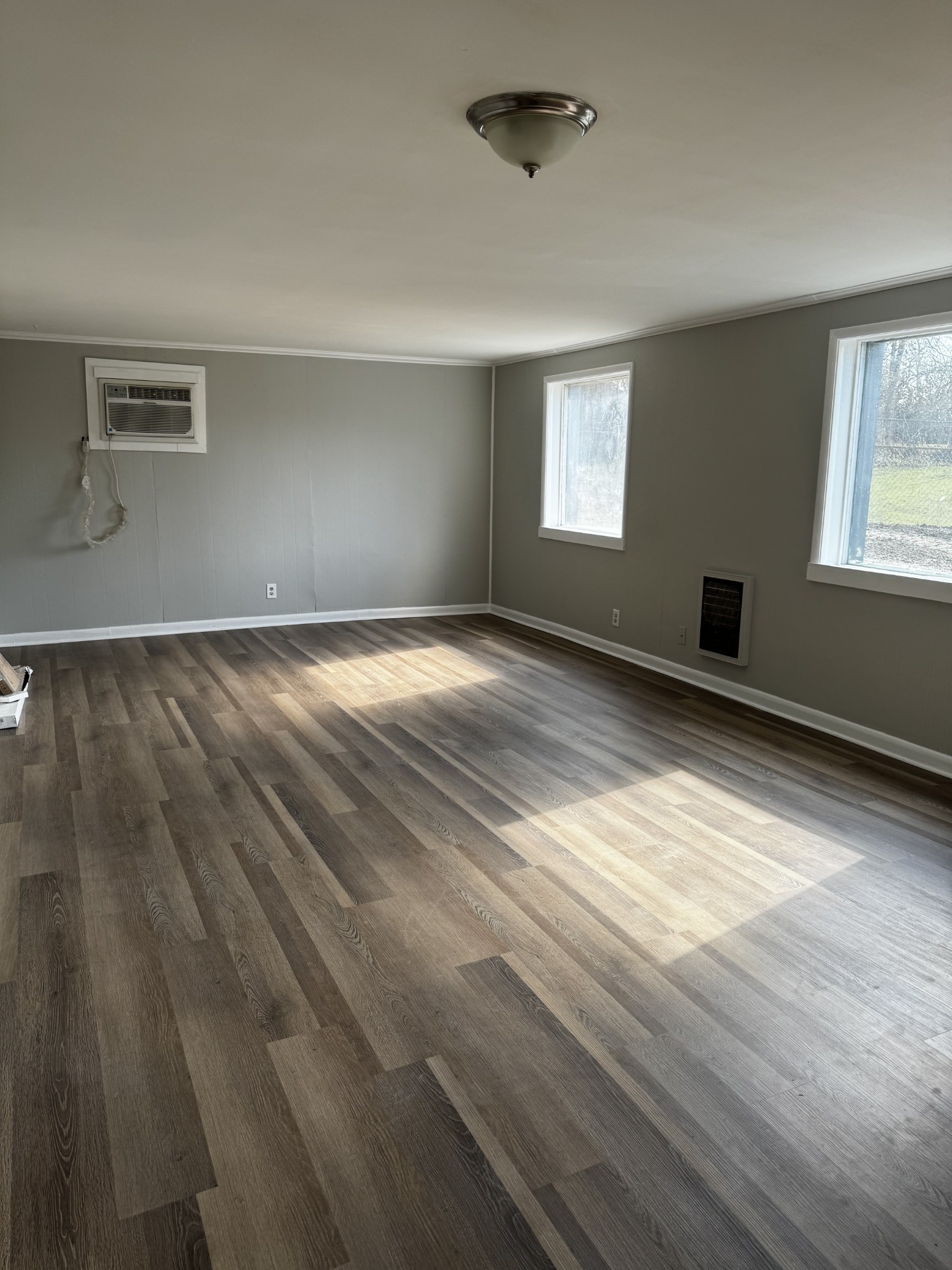 1814 County Hospital Road Nashville, TN 37218 - Photo 11 of 18 a view of an empty room with wooden floor and a window