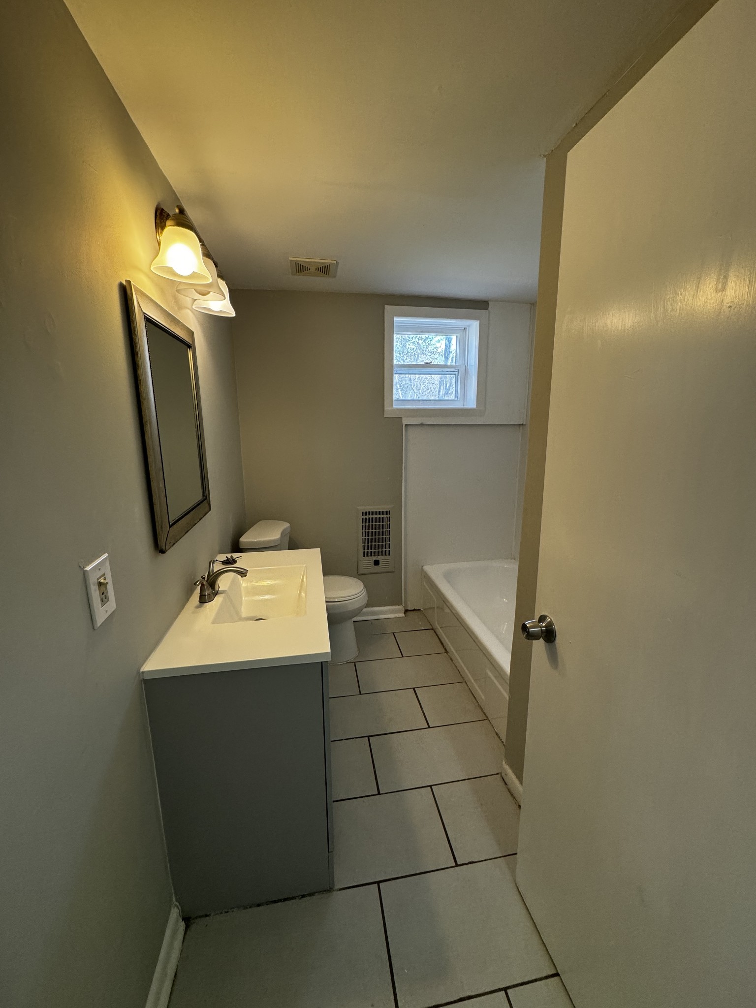 1814 County Hospital Road Nashville, TN 37218 - Photo 15 of 18 a bathroom with a sink toilet and mirror