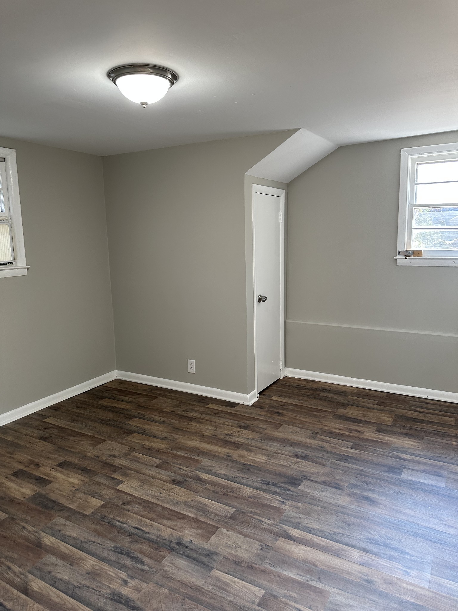 1814 County Hospital Road Nashville, TN 37218 - Photo 5 of 18 a view of an empty room with wooden floor and a window