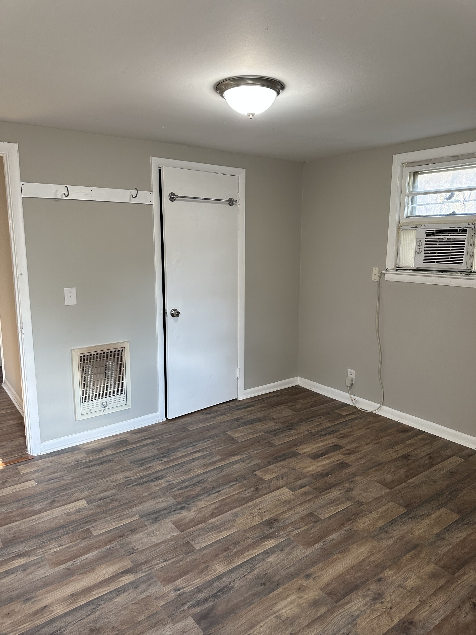 1814 County Hospital Road Nashville, TN 37218 - Photo 6 of 18 a view of an empty room with window and wooden floor
