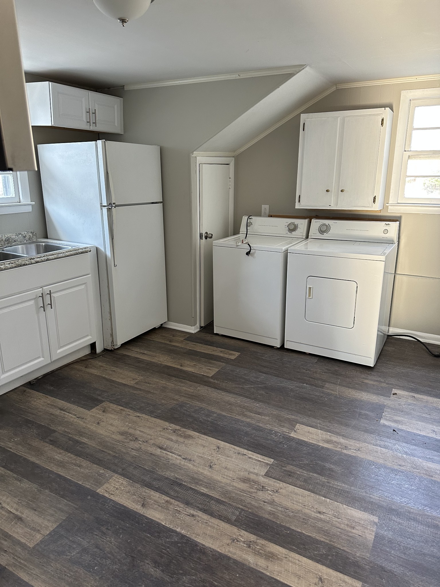 1814 County Hospital Road Nashville, TN 37218 - Photo 7 of 18 a utility room with cabinets washer and dryer
