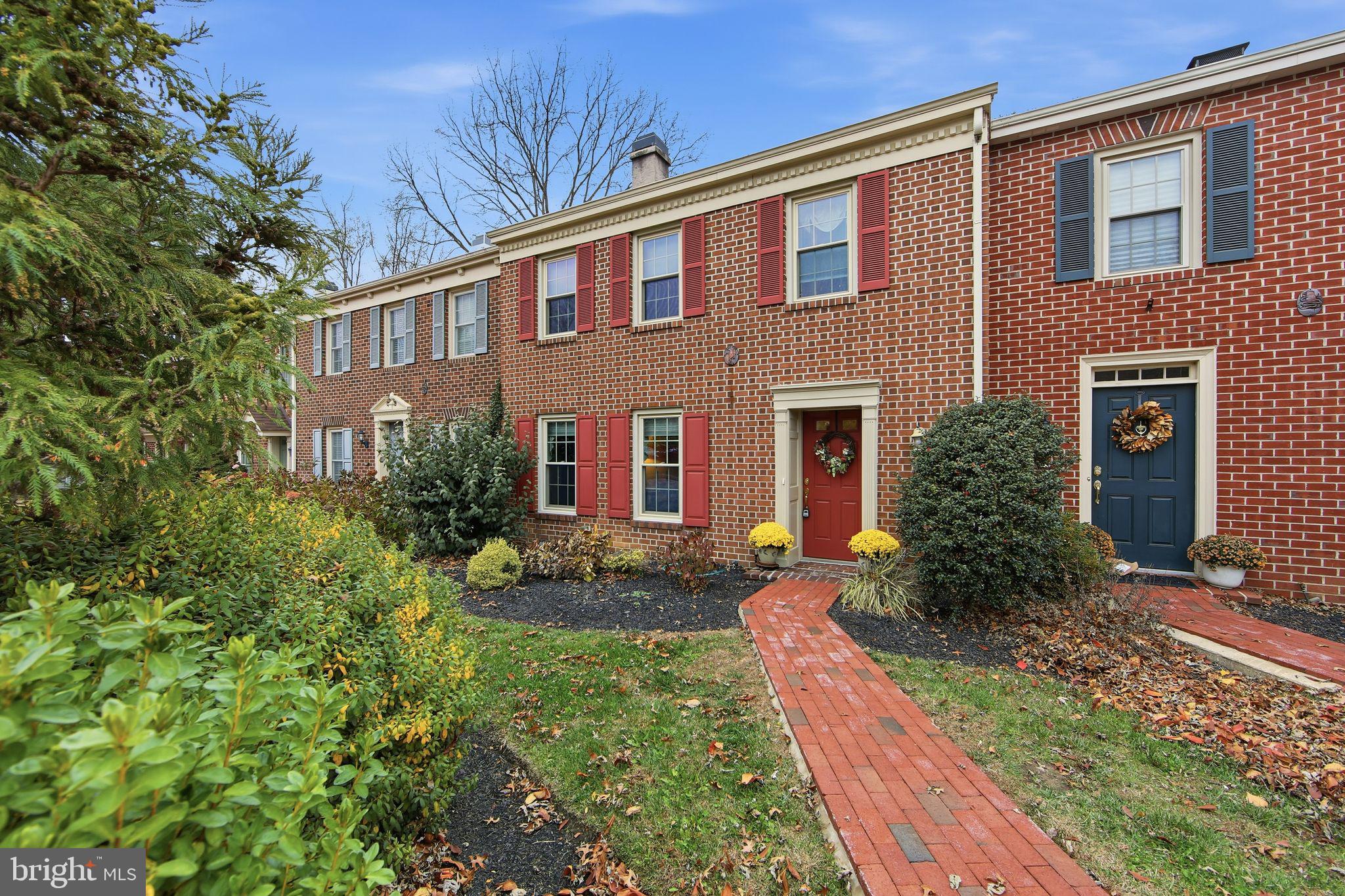 201 Penns Lane, Unit 201 Malvern, PA 19355 - Photo 1 of 30 a front view of house with yard and green space
