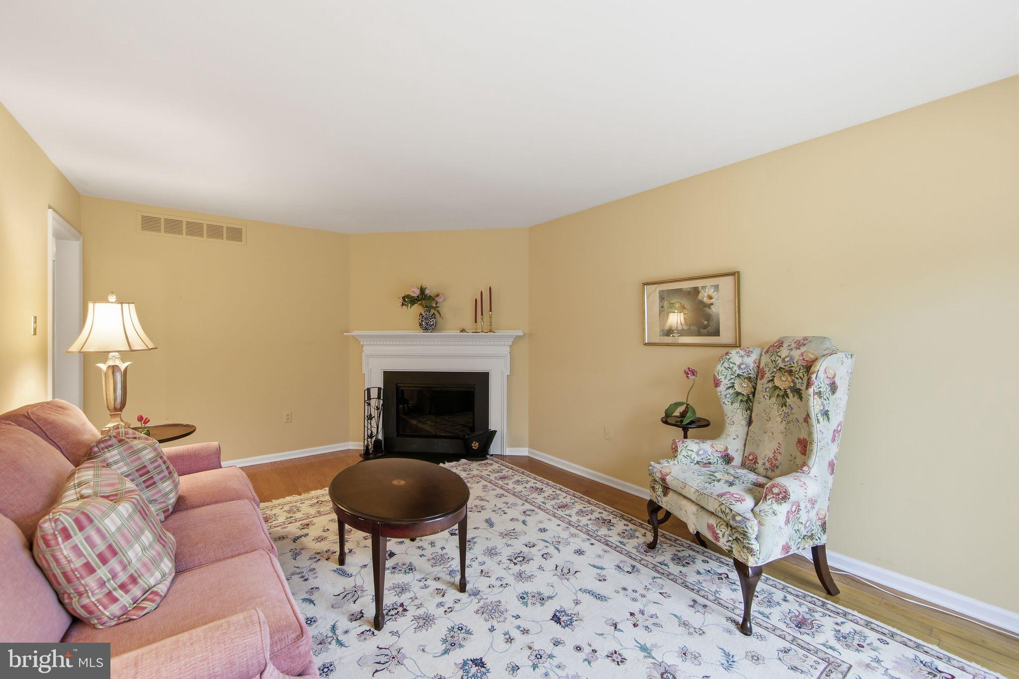 201 Penns Lane, Unit 201 Malvern, PA 19355 - Photo 11 of 30 a living room with furniture and a fireplace