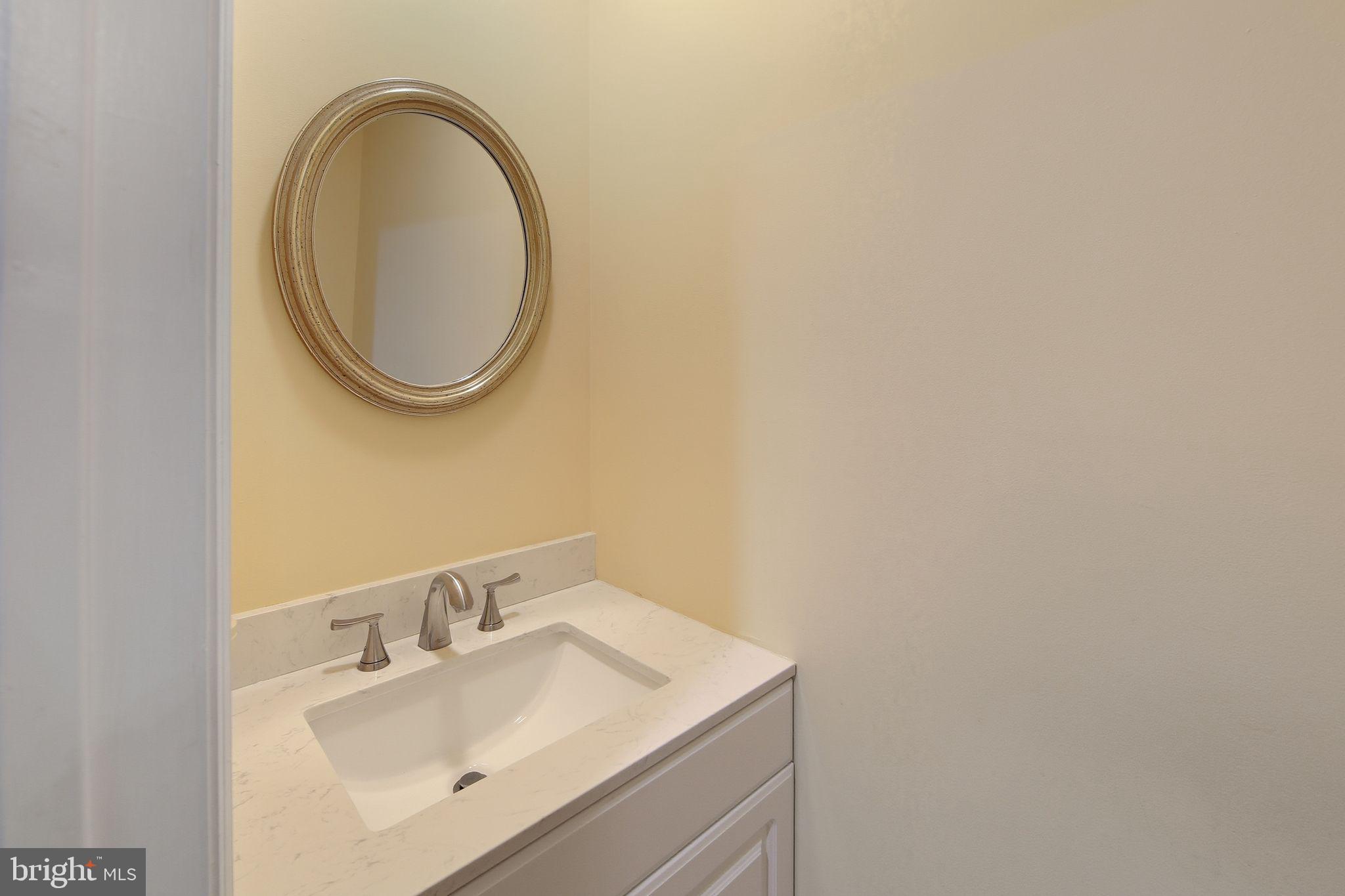 201 Penns Lane, Unit 201 Malvern, PA 19355 - Photo 17 of 30 a bathroom with a sink and a mirror
