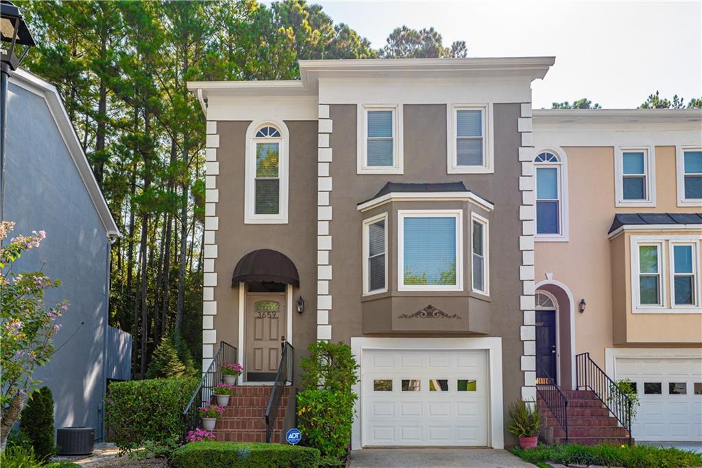 3659 East Bay Street Duluth, GA 30096 - Photo 1 of 1 front view of a brick house with a yard