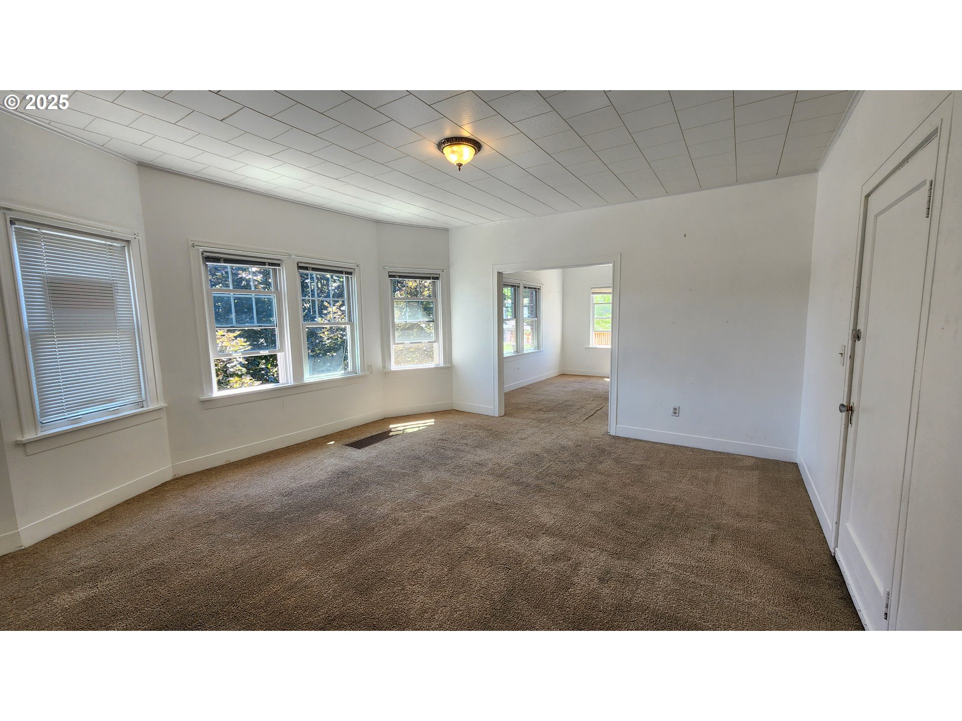 315 Gale Street Heppner, OR 97836 - Photo 15 of 45 a living room with a couch and windows