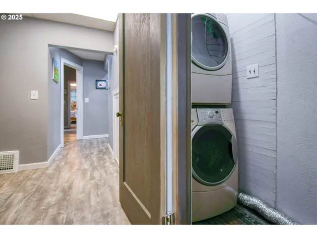 a view of a hallway with washer and dryer