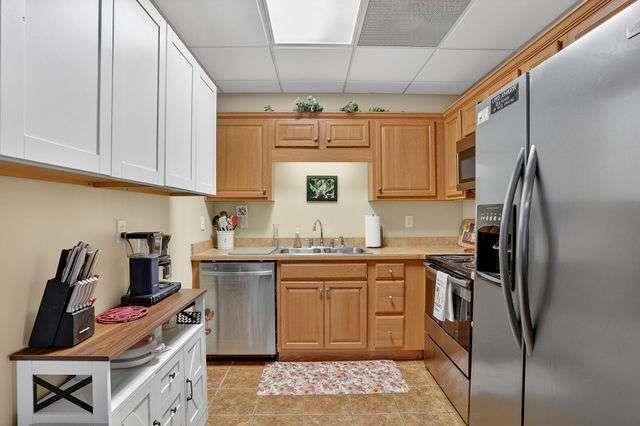8179 Pineview Court Villa Rica, GA 30180 - Photo 24 of 41 a kitchen with stainless steel appliances granite countertop a sink stove and refrigerator