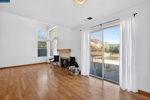 a view of a room with window and wooden floor