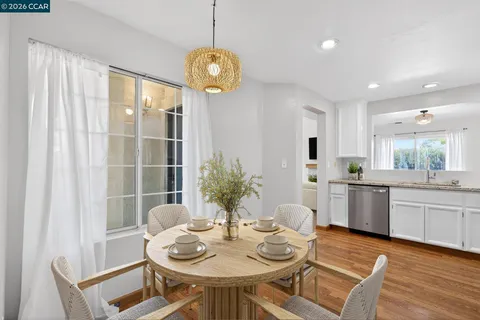 a kitchen with a table and chairs in it