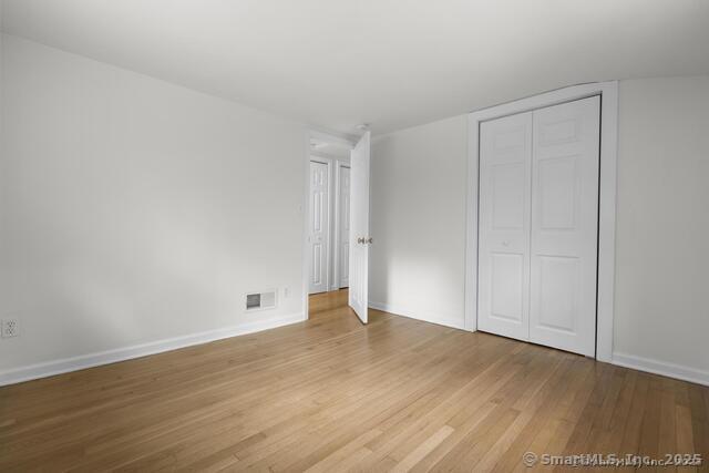 89 Book Hill Road Essex, CT 06426 - Photo 19 of 40 a view of an empty room with wooden floor