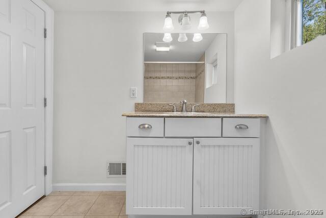 89 Book Hill Road Essex, CT 06426 - Photo 21 of 40 a close view of a sink and cabinets