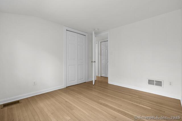 89 Book Hill Road Essex, CT 06426 - Photo 25 of 40 a view of an empty room with wooden floor