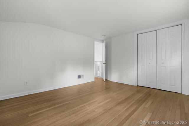 89 Book Hill Road Essex, CT 06426 - Photo 27 of 40 a view of an empty room with wooden floor