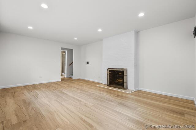 89 Book Hill Road Essex, CT 06426 - Photo 29 of 40 a view of an empty room with a fireplace