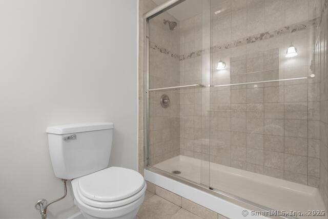 89 Book Hill Road Essex, CT 06426 - Photo 31 of 40 a bathroom with a shower a toilet and a glass window