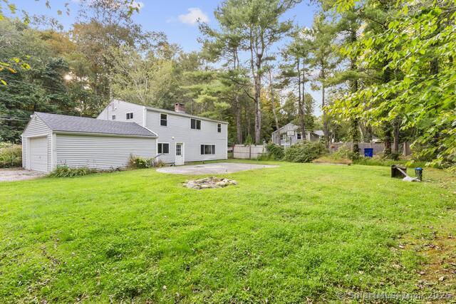 89 Book Hill Road Essex, CT 06426 - Photo 38 of 40 a view of a white house with a big yard and large tree