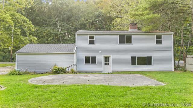 89 Book Hill Road Essex, CT 06426 - Photo 5 of 40 a front view of a house with a yard and garage