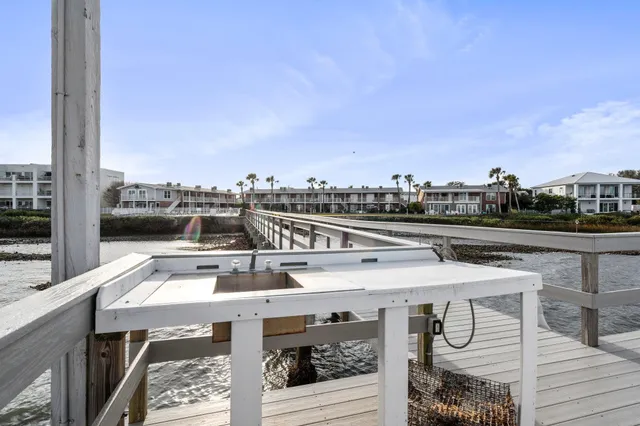 a view of a balcony with two chairs and a table