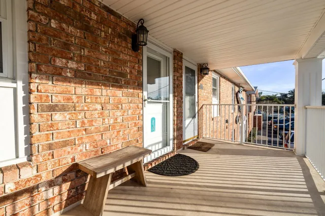 a view of a balcony and wooden floor